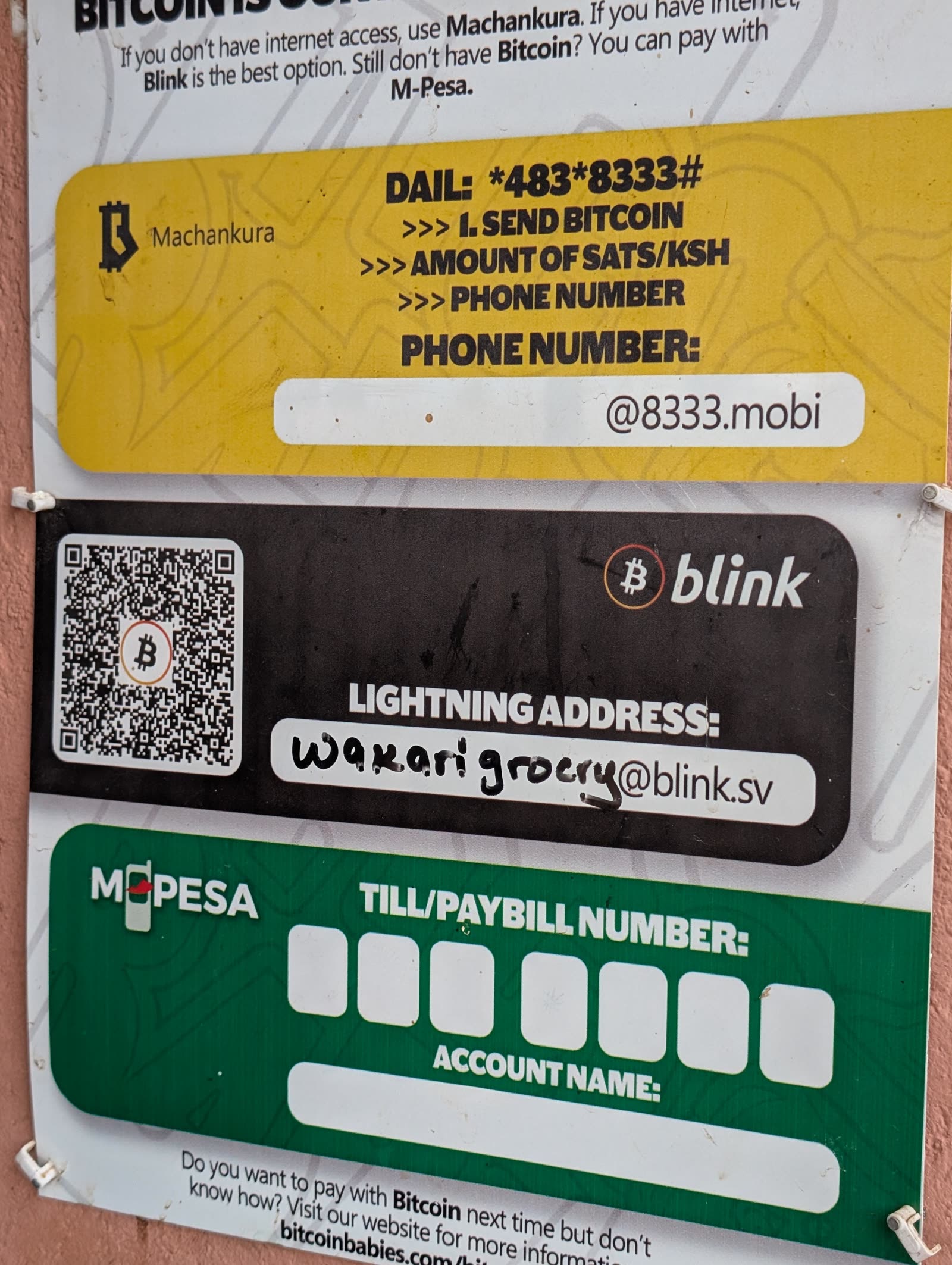 Wakari Grocery payment poster in Matangi, Kenya showing a Lightning address QR code next to M-Pesa payment options