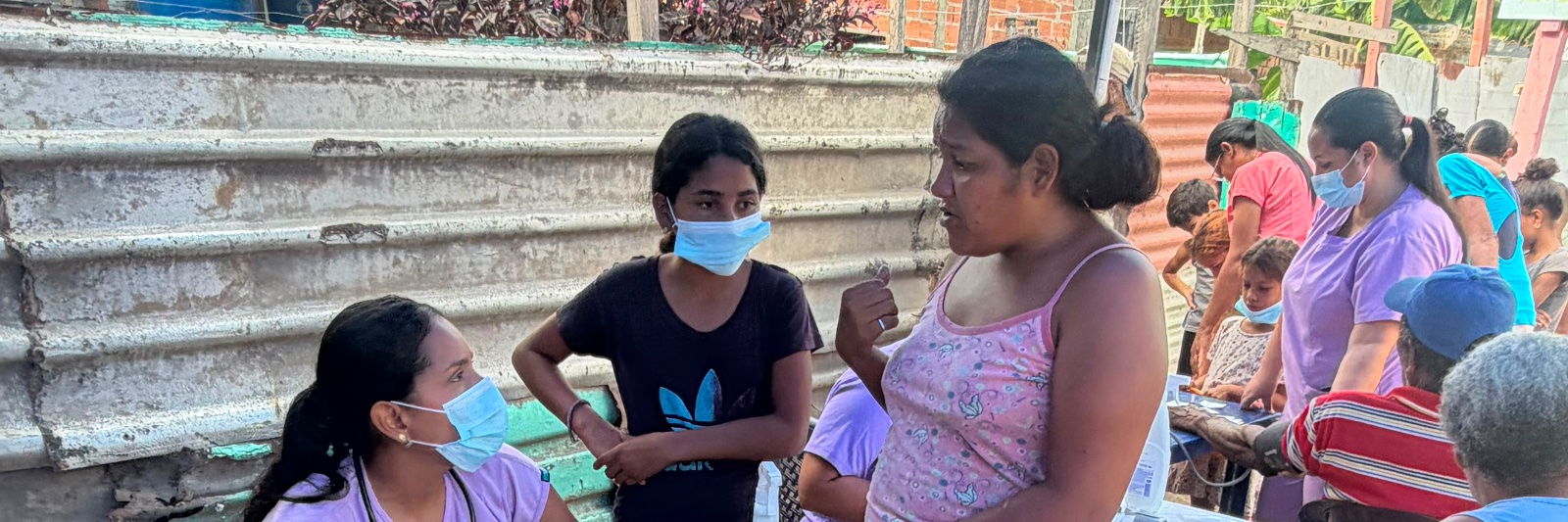 Volunteer doctors and nurses running a Medical Brigades Fund clinic in a Venezuelan earthquake shelter